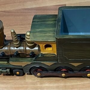 Green and Brown Wooden Train Toy with Yellow Window Accent